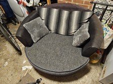 Cuddler Swivel Chair Beige Grey Colour.
