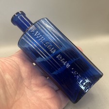 RARE VICTORIAN BLUE GLASS POISON BOTTLE EMBOSSED WITH J WILSON BONESETTER