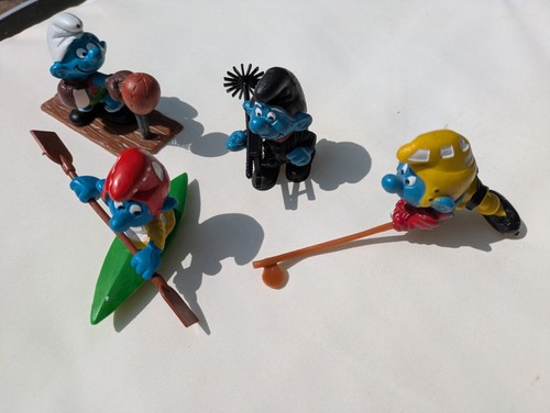 Four vintage smurf figures - vintage,