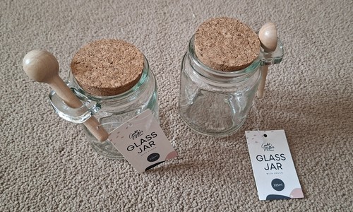 Two small glass jars with - small,