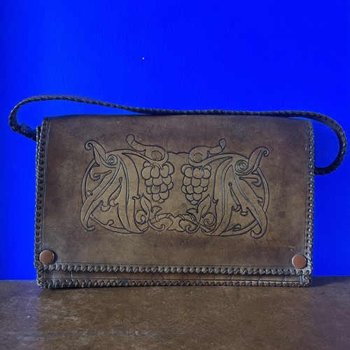Antique hand tooled leather - hand,