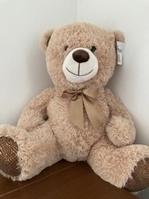 Big And Soft Cuddly Teddy Bear With Bow Around The Neck