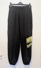 Nike swoosh yellow tick jogging bottoms black size meduim