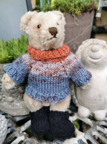Hand knitted teddy bear