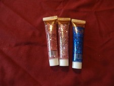 Three tubes of face and body glitter- Pink x 2 and Blue