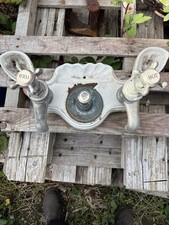 Antique cast iron taps on a enamel cast iron base Made By John Holding &sons