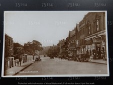 Shops & vintage cars, High Street, ALDERSHOT, Hampshire. RPPC. Austin car sales