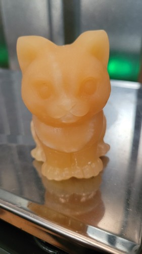 Orange calcite crystal sitting - calcite,