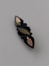 CARVED BLACK BAKELITE BROOCH