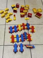 Large collection of Duplo train engines and trucks including locomotive