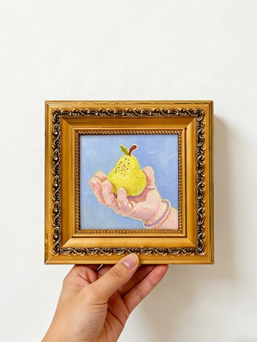 Hand holding pear oil - holding,