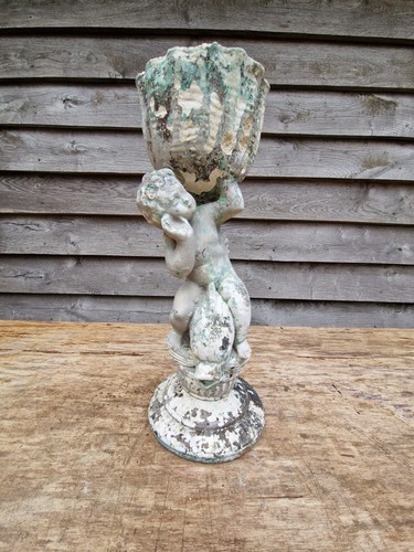 Cherub riding dolphin - cherub, holding