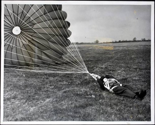 Female parachutist unfastens