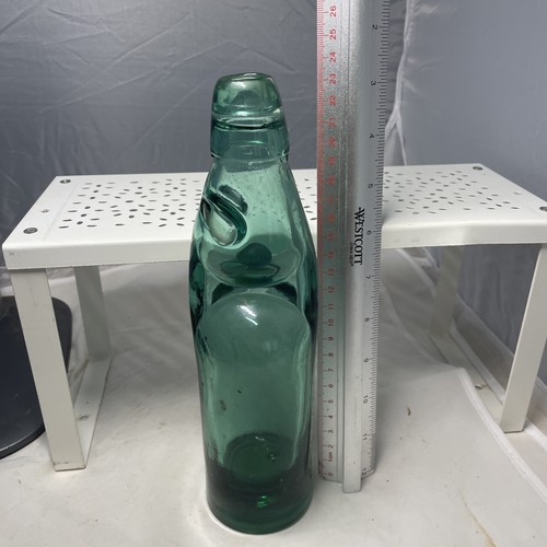 Collectors green bottle with - , a