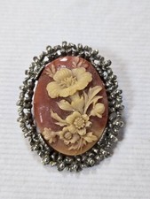Cameo style flower oval metal