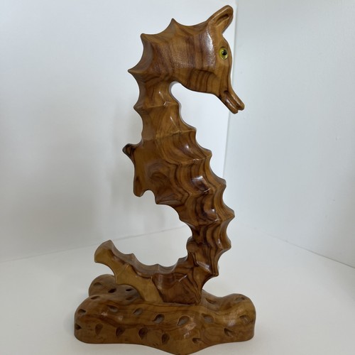 Hand carved wooden seahorse - hand,