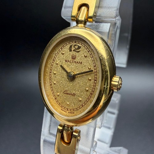Waltham oval gold dial - waltham,