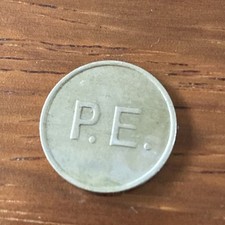 P.E. Token / Coin maybe a Electric meter token 
