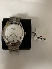 Tissot PR100 Men’s quartz watch with plastics, label and display holder.
