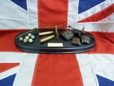 WW1 Somme Battlefield relics - Trench art displayed on a black wooden base -