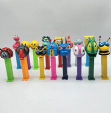 15 Bugz PEZ Dispensers, SpongeBob SquarePants, Smiley Face, She-Saur Large Lot