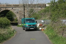 Photo 6x4 Removing the rubbish