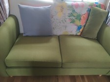Green and beautiful flowered sofa