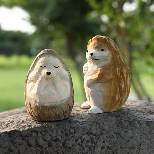 Hand carved wooden hedgehog - hand,