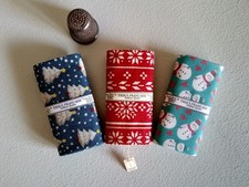 Three Miniature Bolts Of Christmas Fabric