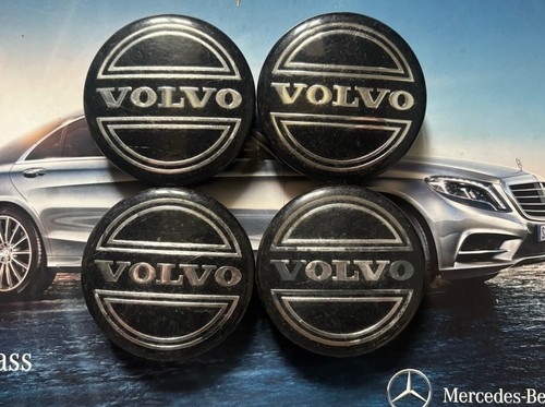 Four genuine volvo wheel caps - four,