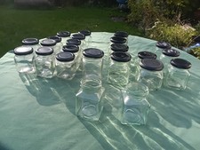 Jars, all square x23,  Glass. 21 have lids, 2 do not hav lids. Assorted sizes.
