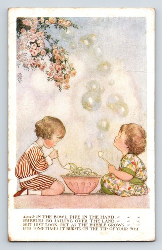 Children blowing bubbles - 'blowing, bubbles'