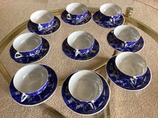 SET OF NINE JAPANESE BLUE AND WHITE EGGSHELL PORCELAIN CUPS AND SAUCERS