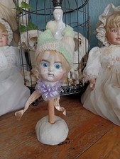 Previously Repaired Antique Bisque Doll Head Revamped Into Jester Rattle.