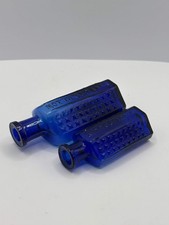 2 old blue flat back poison bottles