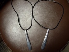 Two spoon pendant necklaces