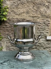 A twin-handled silvered metal