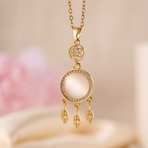 Gold tone round crystal charm - gold,