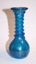 Sand cast blue  vase- seven and a half inches tall and unused.
