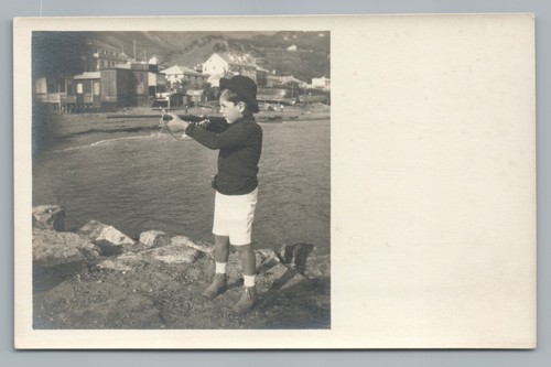 Toy rifle boy taking aim - taking,