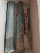 Artillery Shell Cases And  Two Other Things Which Are  Unknown...
