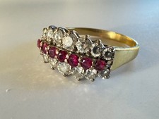 A Ladies ruby and diamond three row 18ct gold ring