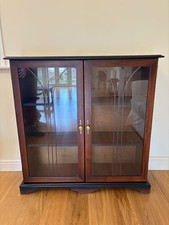Pretty Dark Wood Display Cabinet with Glass Doors and Solid Shelves