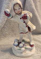 GIRL THROWING SNOWBALLS -