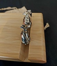 Golf bag cufflinks, used, in fair condition