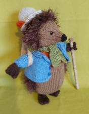 Hedgehog with knapsack. Hand