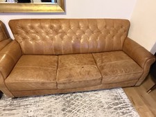 Pair of brown leather sofas