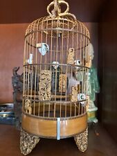 A Fancy Bird Cage With Bamboo