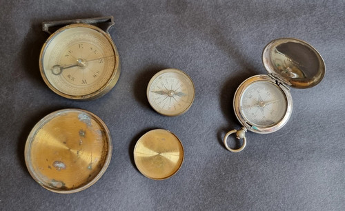 Two antique brass compasses - , &