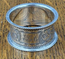 A hand engraved sterling silver napkin ring Chester 1898